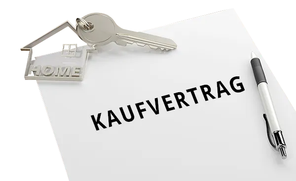 Kaufvertrag mit Kugelschreiber und Schlüssel